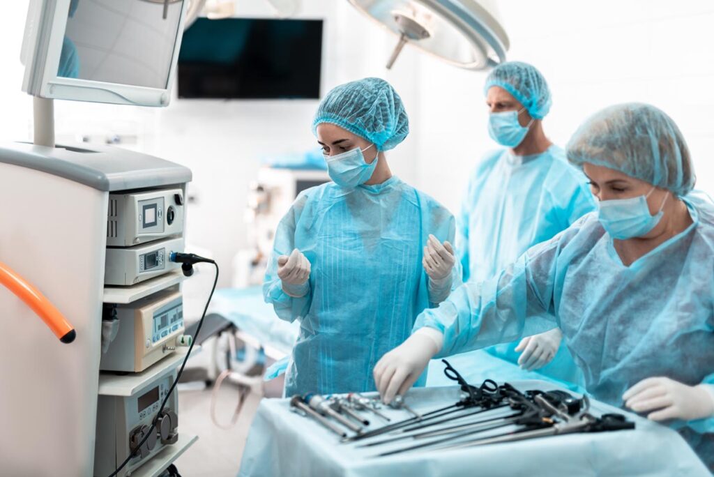 Medical workers preparing for laparoscopic surgery