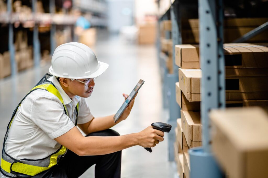 Warehouse workers use scanner checking and scan the barcode