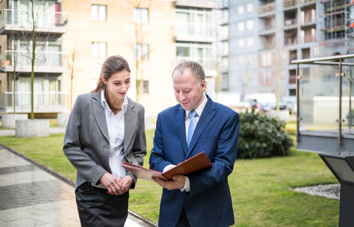 Two business people discussing outside the office